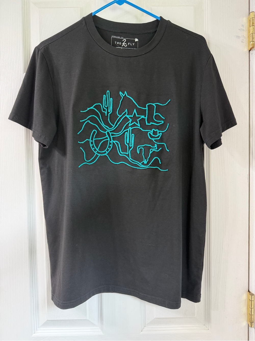 Two fly black tee with turquoise embroidery
